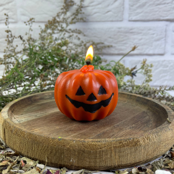 Восковая оранжевая свеча - тыква Halloween